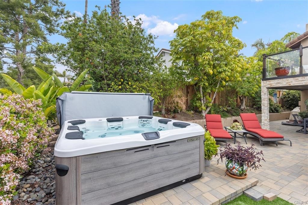 Backyard is a personal resort with jacuzzi, built-in BBQ island, built-in gas fireplace, custom outdoor shower, exquisite hard and soft scape.