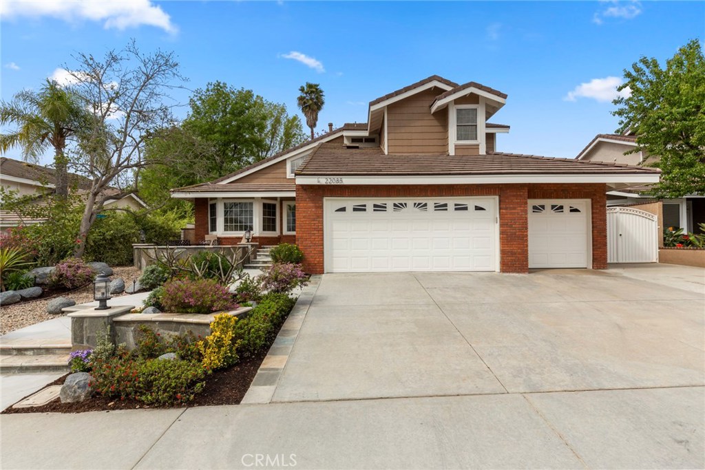 Price Improvement!! All that Lake Forest has to offer! 4 bed 3 bath,w 1 bed&bath down.Appx 2246 sqft on extremely private appx 8775 sqft lot.Amazing curb appeal, gorgeous entry w patio, extensive natural stone hardscape & lush landscape.Extended 4 car drive  w possible gated storage access.Enter thru custom front door to formal living room with volume ceiling &laminate flooring that extends throughout the house. Recently remodeled, eat in kitchen w Corian counters,grey cabinets,glass tile backsplash & stainless LG appliances overlooks backyard,pool &entertainment area.Large family rm w fireplace,ceiling fan &TV.Remodeled down bath w custom vanity,quartz counter & stainless fixtures. Custom shower w glass enclosure& Hans Grohe fixtures &rain shower.Huge master suite w volume ceiling&modern ceiling fan.Master bath w dual vanity,oversized jacuzzi tub, custom shower &huge walk-in closet w organizers.Large secondary bedrooms finish the spacious 2nd floor.One bedroom used as office w built-in desks&cabinets.Backyard is entertainer’s dream! Huge extremely private pool w Baja step & spa. Built in stainless BBQ &sink, eat at bar & cozy fire pit. Tropical landscaping w beautiful Coral, Lemon, Lime &Tangelo trees. Large gated side yard w 2 storage sheds.Inside laundry. Oversized 3 car garage with sink & builtin storage.Tesla solar, newer pool equip, HVAC, water heater &roof.Energy efficient tinted vinyl windows throughout.Located near shopping, entertainment and freeways!
