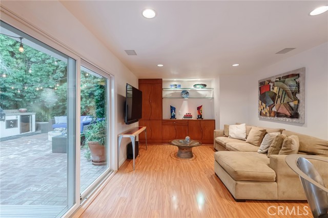 Family room with custom built-in cabinetry and a huge slider for perfect indoor/outdoor living