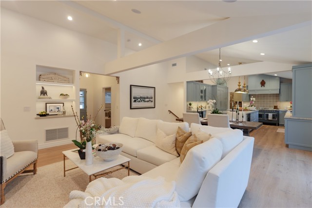 Warm and inviting, the open family-style floorplan with lighted architectural niche is perfectly suited for gatherings both large and small.