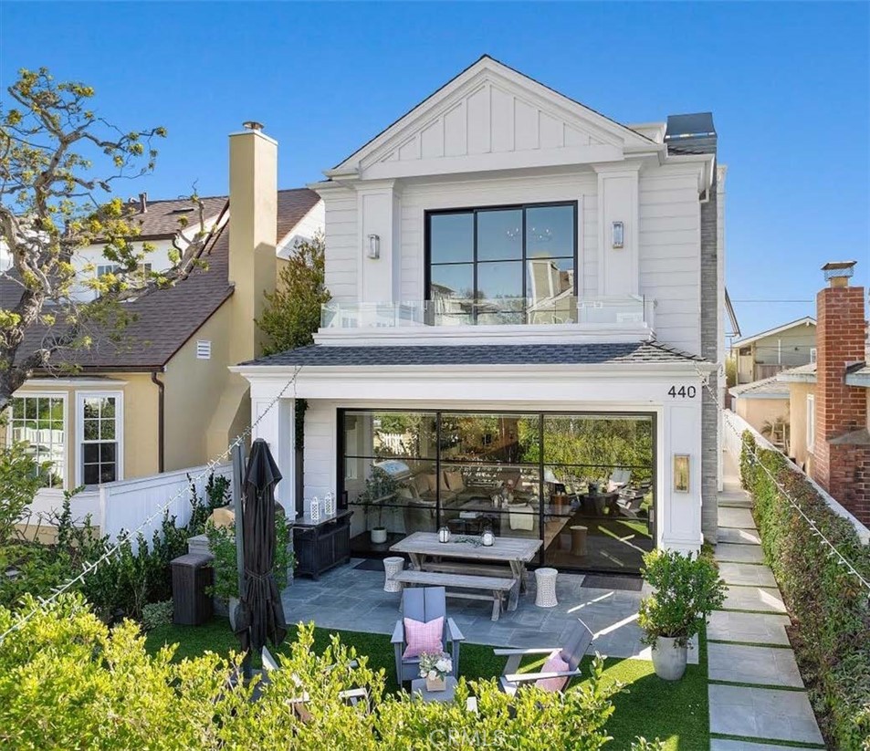 Homes of this caliber rarely become available, especially on one of Manhattan Beach’s most sought-after flat walk streets. Then there’s 440 8th Street, a FULLY FURNISHED, TURNKEY masterpiece where Hamptons sophistication meets California beachside living. Ideally located just blocks from the sand and downtown, this custom-built home redefines luxury with a rare traditional floor plan, where the first-floor living room, dining room, and chef’s kitchen seamlessly connect.
The meticulously designed kitchen offers Krion countertops, top-of-the-line appliances, an 8-burner range, and endless storage—so intuitive it may even inspire culinary greatness. Expansive Kolbe Steel Doors blur the line between indoors and outdoors, opening to a lushly landscaped front yard with a built-in BBQ and patio, perfectly blending privacy and the vibrant walk street lifestyle.
Upstairs, you’ll find four ensuite bedrooms, including the luxurious primary suite with vaulted ceilings, a gas fireplace, dual walk-in closets, a spa-style bathroom, and a private patio. The fifth bedroom, perched on the third floor, is a versatile retreat ideal for guests or in-laws, alongside a spacious family room. Whether you need a theater, gym, or playroom, this adaptable space offers endless possibilities.
The pièce de résistance is the oversized rooftop deck, an entertainer’s dream complete with a wet bar, 10-person hot tub, gas fireplace, built-in heaters, and ample seating for year-round enjoyment. This is where California’s indoor-outdoor living truly shines—and where you’ll undoubtedly host the neighborhood’s most memorable gatherings.
Every detail of this home has been curated with precision, from exquisite walnut floors and outdoor gas lamps to smart home technology, solar panels, Tesla chargers, and commercial-grade Wi-Fi for seamless work-from-home convenience.
Move-in ready, 440 8th Street is more than a home—it’s a statement. Offering unparalleled luxury, functionality, and walk street charm, this is your chance to live the Manhattan Beach lifestyle at its absolute finest. *Can be SOLD FULLY FURNISHED*