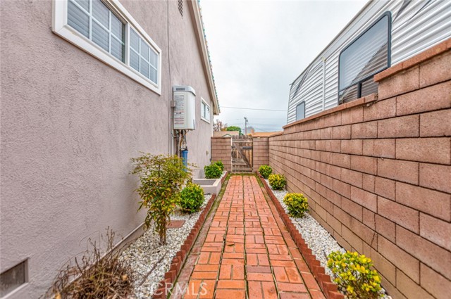 Side of home with tankless water heater