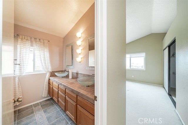 Primary bath and bedroom