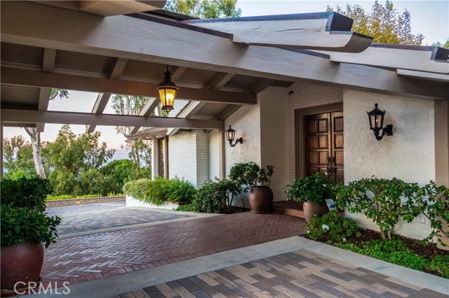 Porte Cochere connects the front entry and the three car garage.