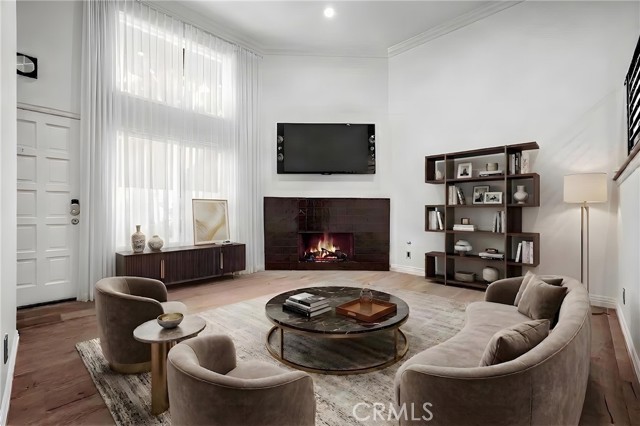Formal living room with Hershey-chocolate tiled gas/wood burning fireplace and high ceilings. Virtually staged. Formal living room with Hershey-chocolate tiled gas/wood burning fireplace and high ceilings. Virtually staged.