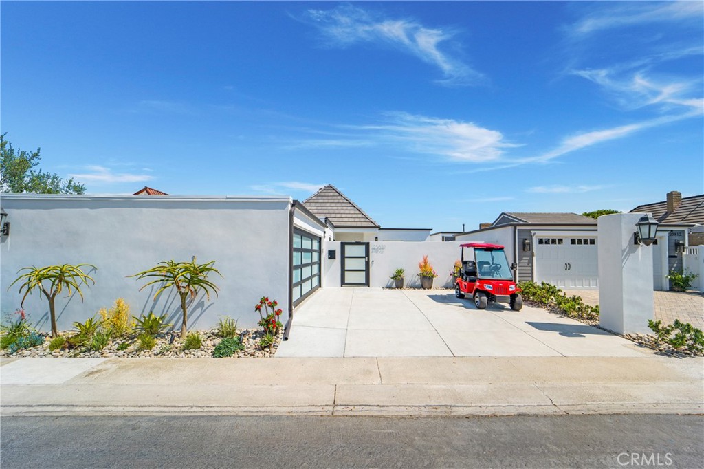 Welcome to an extensively REBUILT single-story coastal home nestled in the heart of the prestigious, 24 hr guarded-gate community of Niguel Shores.
Remodeled from the studs up, this exceptional coastal single-level retreat offers 4 bedrooms & 3 baths that epitomizes meticulous attention to detail & craftsmanship. You are greeted by a large driveway, a rarity among Niguel Shores homes- leading to a private, gated front yard with custom stack stone firepit, lighted water fountain & a modern custom glass paneled two-car garage door. Step into a bright, open living space with a 20-foot ceiling where transitional elegance meets coastal charm seamlessly flowing from the kitchen to the living & dining areas. The chef’s kitchen features custom white shaker cabinets, 2 large pantries, quartz countertops, & high-end Thor Appliances including a gas range, refrigerator, dishwasher, built-in microwave & beverage center. The large quartz waterfall island offers bar seating for 4 & storage. The custom quartz top desk & entry table add cohesive aesthetics. The 7 new skylights offer abundant natural light & air. The Garber Blinds offer shade & energy savings. Water-resistant engineered wood floors throughout are perfectly durable to handle beach activities! Each of the 3 bathrooms are tiled with high quality MSI Porcelain & beach pebble shells accenting the discerning Justice handcrafted bar lights & LED lighted mirrors. Separate laundry room with gas hook-ups, new cabinets & porcelain tile floor. Modern technology abounds with pre-wired automation, Cat-6 ethernet & wireless access. The exterior has smooth coat stucco, tile roof & new fascia boards, hardscape, irrigation & drainage. The attached garage with new epoxy flooring. The maintenance-free backyard includes potted drought-tolerant plants with built-in drip systems, polished rocks, a water fountain & a large side yard for pets. The community of Niguel Shores offers direct beach access, a private oceanfront bluff & park, newly renovated clubhouse, an Olympic-size pool, spa, pickle ball & tennis courts. Minutes from the Ritz- Carlton, Waldorf Astoria & Dana Point Harbor. Don’t miss out on this incredible opportunity where you will enjoy the sand, sun & surf in a truly unique & desirable living experience in a welcoming and safe community.  Home can also be a rental & investment BEACH BLUFF VACATION RETREAT.