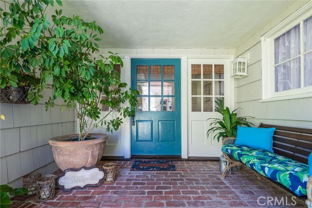 This covered porch is the perfect spot for waving at neighbors and dog walkers, watching kids and pets play in the front yard and enjoying the lush surroundings of your Lunada Bay retreat.