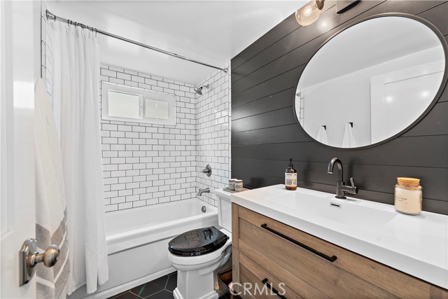 Downstairs full bathroom with tub and shower.