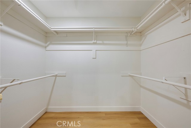 Walk in closet in primary bedroom
