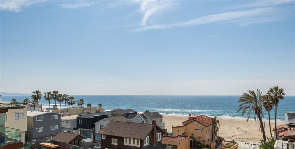 Welcome to this BEAUTIFULLY remodeled, A+ location, corner walk-street custom-built home + rental unit. This home boasts breathtaking white water ocean, sand, & Catalina views, 3-stop elevator, and 11-car parking, which includes a 5-car garage! Yes, you read that right, it has parking for 11 cars, which is unheard of in the MB Sand Section. This property is located in one of the city’s most desirable blocks, the 100 block, & is just moments from the beach, pier, bike path, & downtown MB shops & eateries. The charming main home is about 3,500 SQFT & offers 4 beds, 5 baths, a study, & an amazing, sunny open floor plan upstairs, which is perfect for entertaining. Upstairs you will find the recently remodeled gourmet kitchen that has a huge quartz center island with breakfast bar seating, Thermador 6-burner stove, soft-closing cabinet doors & drawers, large pantry, beverage fridge, ocean views & so much more! The kitchen opens up to the light & bright great room that has sweeping ocean views. Features the great room offers are an ocean view deck, a tiled fireplace with a custom mantle, built-in speakers, powder room, & a large, covered deck that acts as an indoor/outdoor al fresco dining space. Also upstairs, you will find the huge master suite with dreamy ocean, Malibu, & pier views, built-in cabinetry & dresser, crown molding, & stacking sliding glass doors opening to the large deck. The lovely remodeled master bathroom has a walk-in shower with dual shower heads & spa stone flooring, walk-in closet, & a private ocean-view balcony. Making your way downstairs to the middle level, you are greeted with a picturesque study/ library with built-in shelves & cabinetry & an ocean-view deck making it an ideal zen area to read your next novel. Also on the middle level, there is a laundry area with a deep sink, powder room, & 3 bedrooms. The unusually large, ocean-view brick front patio is a perfect space for entertaining guests. The remodeled rental unit has 2 beds, 2 baths, about 1,100 SQFT, & was recently rented for $7,500/mo. Additional amenities include a formal entry w/ a charming Dutch door, ample storage, shiplap wood walls, water softener, all baths & kitchens have recently been remodeled, A/C on the top floor, dual zoned heating, new exterior paint, security system, 3 ocean view balconies, indoor/outdoor speakers, wide-plank hardwood floors, crown molding, plantation shutters, custom leaded glass windows, skylight, ceiling fans, & custom window coverings.