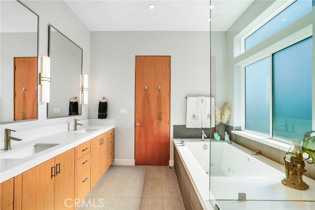 Lots of counterspace in this bright primary bathroom