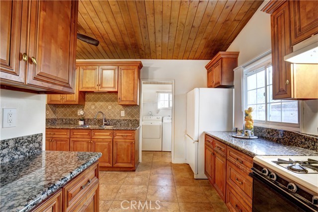 Kitchen looking toward laundry area