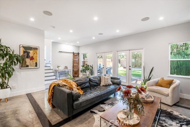 double French doors that open to entertaining backyard