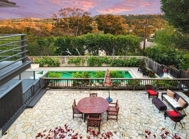 Spectacular terraced back yard with fabulous outdoor living, lap pool, and spa.
