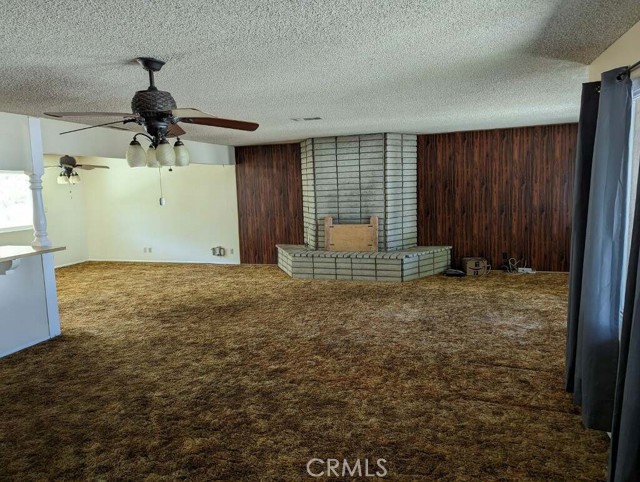 Open floorplan with wood or gas burning brick fireplace