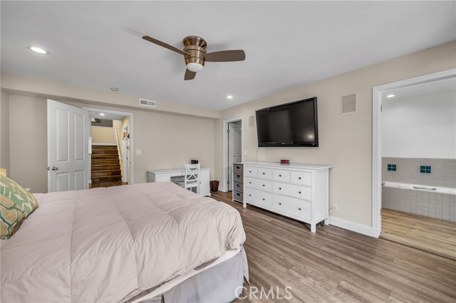 Ensuite primary bedroom with walk in closet