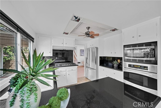 Another view of the kitchen with breakfast counter