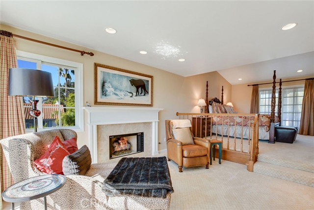 Master bedroom retreat area with fireplace