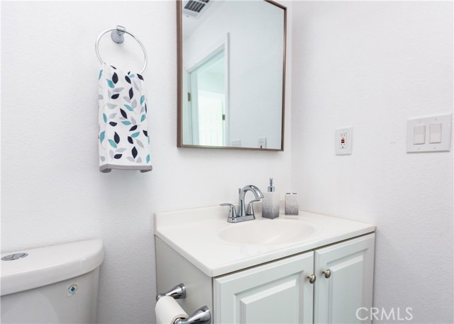 Bathroom with New Vanity, Mirror & Toilet