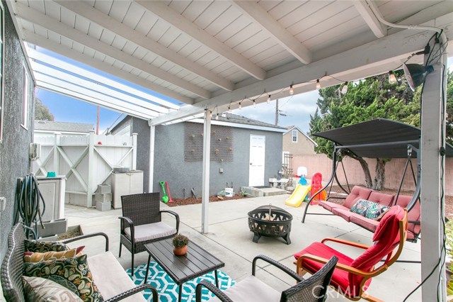 Fenced and semi-covered Patio and Backyard is perfect for family gatherings and playground for kids.