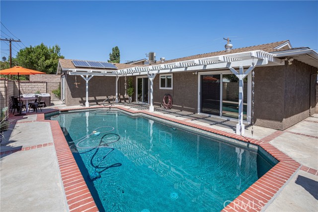 Another view of pool area including hot tub.