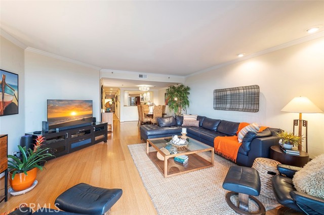 View of living room, dining room, kitchen and hallway