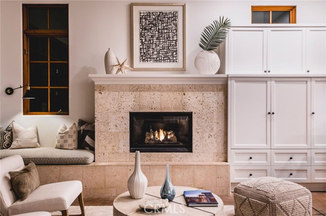 Curl up in front of the ocean-inspired fireplace.