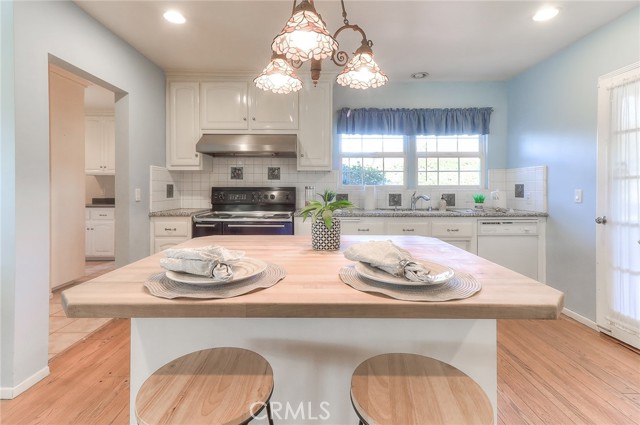 Island with butcher block countertop and great storage.