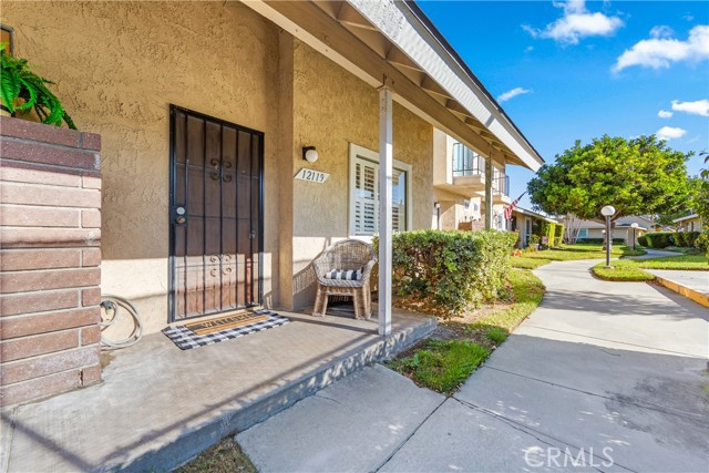 This lovely townhouse is situated in the highly regarded Stonegate community of West Garden Grove, which is conveniently located near parks and esteemed schools. Residents enjoy a peaceful and serene environment. The community offers a variety of amenities, including a delightful pool, spa, clubhouse at its center, and a private tennis court at the back, which is suitable for pickleball. This home conveniently borders the tennis courts.
The floor plan is thoughtfully designed. On the first floor, the spacious living room features an electric-start fireplace and French doors that open to a charming back patio courtyard. Through this courtyard, residents have access to a private two-car garage, which can be reached via a private alley. Inside the garage, there is a dedicated laundry area equipped with a stackable washer and dryer. The courtyard is filled with natural light throughout the day, creating an inviting space for family gatherings and a lovely garden.
Adjacent to the kitchen is the dining area, which is bright and cheerful, showcasing fresh paint, a new stove, and ample cabinet space. Additionally, there is a versatile space off the kitchen enclosed with a wall of glass French doors, providing the option for a third bedroom, office, family room, gym, or playroom. A half bath on the first floor adds to the convenience of the space.
On the second floor, there are two generously sized bedrooms. The primary bedroom features two large closets, including a walk-in closet, and the ensuite bathroom is both elegant and practical, complete with an open vanity area, a jetted soaking tub, and a private toilet area. The second bedroom is equally appealing, boasting its own adjacent bathroom, a walk-in closet, and enough space for a desk under the window. A floor-to-ceiling linen closet enhances the functionality of the second level.
The community offers a range of amenities, including a pool, spa, and clubhouse, providing residents with enjoyable recreational options. Convenient access to major freeways, such as the 405, 22, and 605, enhances connectivity to the surrounding area. Families will appreciate the quality education available through the esteemed Garden Grove Unified School District, which includes Enders Elementary, Hilton D. Bell Intermediate, and Pacific High School.