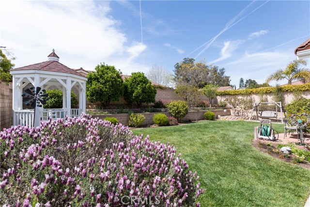 Lush green grass for children to play in this backyard.