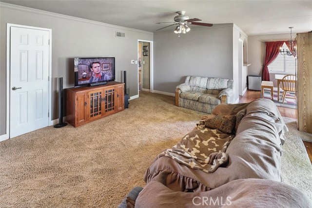 Spacious open floor plan with fireplace and slider out to the patio.  Just cleaned the carpets! Just painted.