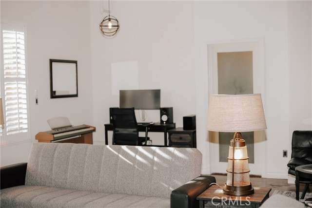 Living Area with Bathroom Door in the background.