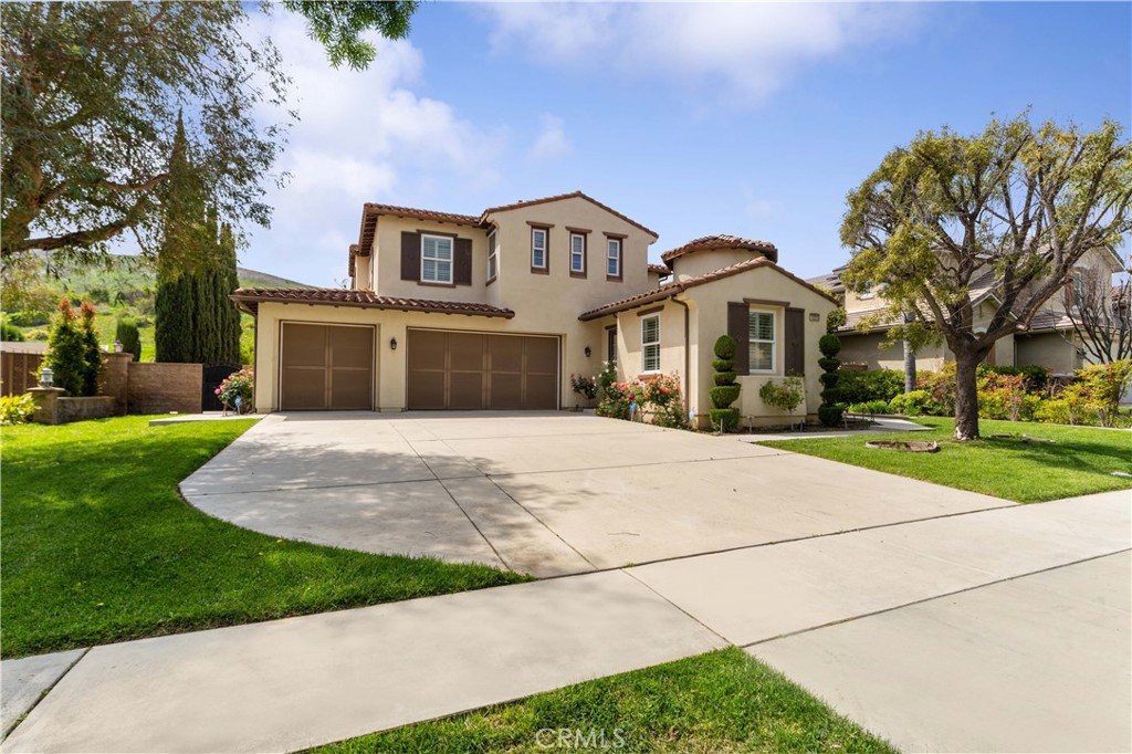 Experience refined living in this charming Mountain View two-story home, situated within an exclusive gated next to the Western Hills Country Club Golf Course. This elegant residence features 5 bedrooms and 3.5 baths previously Model, including a luxurious master suite with a fireplace, a walk-in closet, and private balcony. The gourmet kitchen, with granite countertops and ample storage, is perfect for entertaining alongside a convenient prep kitchen. The expansive backyard, featuring a playground and flat open space, offers endless possibilities for outdoor enjoyment, including room for a future ADU or pool. There is an approved Set Building plan for an Expanded Entertainment Room designed by a renowned Architect. A five-car garage with epoxy flooring and double central AC/heat adds to the home's exceptional comfort and convenience. Part of Phase I development by the original developer with lots of upgrades. Enjoy easy access to shopping, schools, and dining.