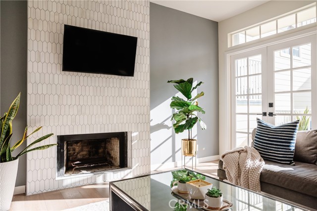 Family room is bathed in light from the 2 sets of french doors that lead to the oversized deck.