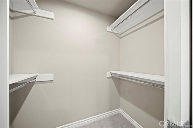 The walk-in closet with custom built-in shelving and hanging options...just bring hangers!
