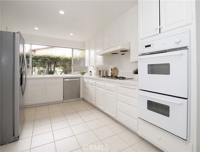 View of the kitchen with lots of counter space.