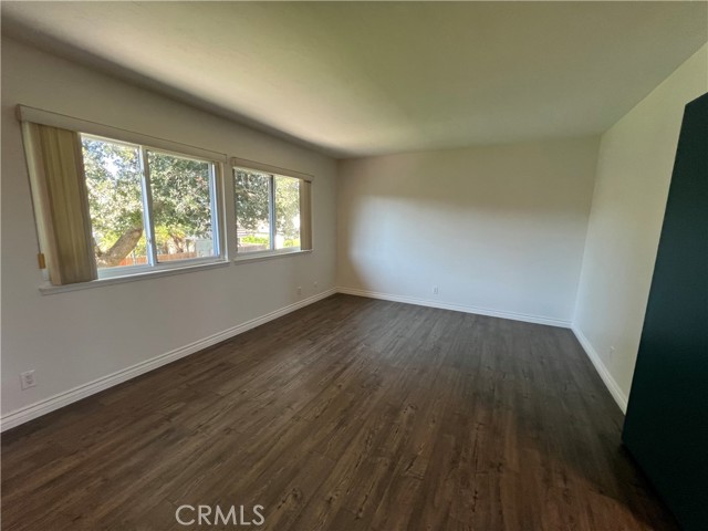 Large Master Bedroom with Laminate
