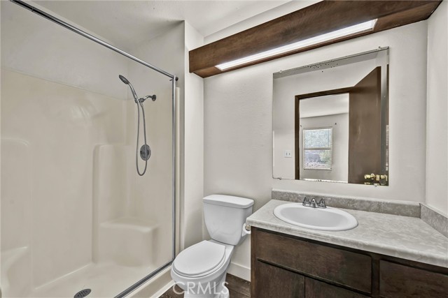 Bathroom with stand alone shower.