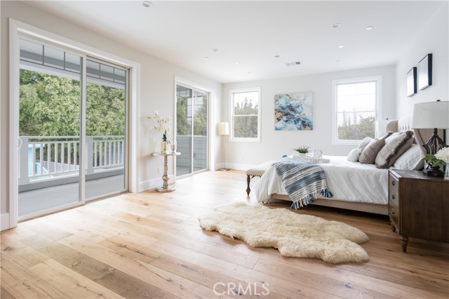 Primary bedroom with treetop views