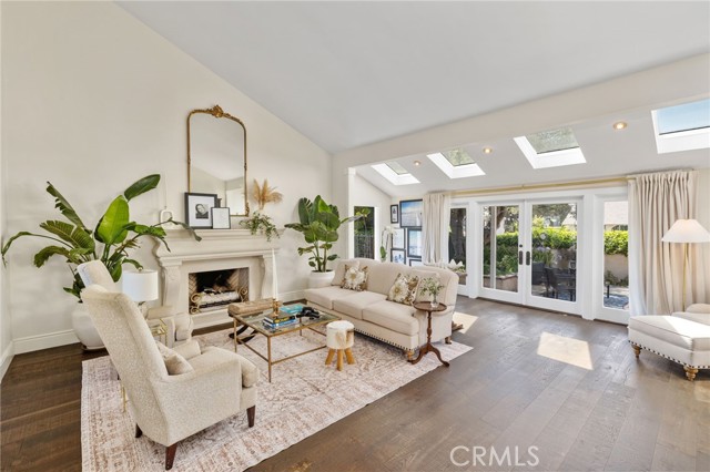 The formal living room overlooking and opens to the courtyard with French Doors.