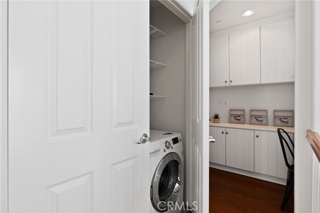 Laundry, with washer and dryer included, and past that, the office.