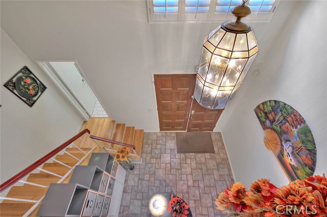 Overhead View Of Foyer Entry.  Stairs Lead To Powder Room.