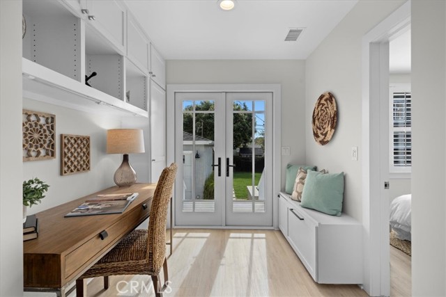 Work area/mudroom opens via French doors to South-facing backyard deck, patio and big grass yard!