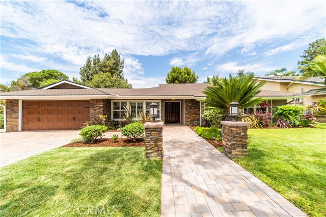 A truly unique property, a single story home on over ½ acre surrounded by lush landscape and a virtual orchard. This open 5 bedroom, 4 bathroom, 3,000+ sqft home is one for the most discerning buyer, extensively remodeled in and out, an entertainer’s home with seamless indoor-outdoor living in your very own oasis. The indoors is exquisitely detailed while the outdoors has been remodeled to include: a kitchen with covered dinette, 25’ of bar seating, smoker, fridge, a beautiful pool with water slide, grotto, fire pit and waterfalls, a raised spa, stone fireplace, cantilevered lounge deck, plus a sports court and putting green. The backyard is second to none, a paradise with its resort-like ambiance. Upgrades include: pool equipment, all bathrooms, kitchen w custom cabinetry, walnut hardwood floors, tumbled travertine tile, electric, lighting, dual-paned windows w shutters, plumbing, solar panels (paid off), electric car charger (garage), and so much more. A truly unique property, a single story home on over ½ acre surrounded by lush landscape and a virtual orchard. This open 5 bedroom, 4 bathroom, 3,000+ sqft home is one for the most discerning buyer, extensively remodeled in and out, an entertainer’s home with seamless indoor-outdoor living in your very own oasis. The indoors is exquisitely detailed while the outdoors has been remodeled to include: a kitchen with covered dinette, 25’ of bar seating, smoker, fridge, a beautiful pool with water slide, grotto, fire pit and waterfalls, a raised spa, stone fireplace, cantilevered lounge deck, plus a sports court and putting green. The backyard is second to none, a paradise with its resort-like ambiance. Upgrades include: pool equipment, all bathrooms, kitchen w custom cabinetry, walnut hardwood floors, tumbled travertine tile, electric, lighting, dual-paned windows w shutters, plumbing, solar panels (paid off), electric car charger (garage), and so much more.