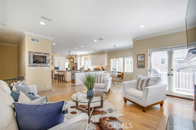 Family room third level with barbecue area on deck through French doors.