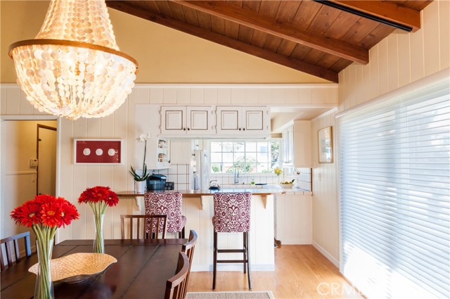 Dining room looking into breakfast bar and kitchen