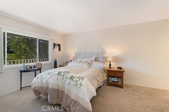 Large master bedroom with new windows and trees views