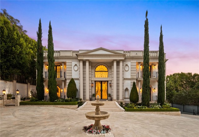 Stunning one of a kind property sitting on a prime Bel-Air lot of 4.77 acre, this classically-inspired 8 bed 13 bath estate is sure to impress! Enter from automatic private gate with stone paved driveway. A detached 2 bed 3 bath guest house is to your left and the main house to your right.
Enter through the grand foyer and double staircase that showcases the 30ft high ceilings with exquisite crown molding. The home features imported marble, fine hardwood floors, Corinthian columns, and rare precious stones in the bathrooms and counter tops. 
The main floor consists of a spacious living, dining room, a gourmet kitchen with oversized kitchen island, breakfast room with butler's pantry, game/billiards room, and gorgeous library/office.
Up to the sprawling staircase, the upstairs is home to the master suite boasting his & hers closets, heated master bath floor, and whether controlled winter closet, 2 terraces with tree top, canyon, and reservoir views, plus 3 additional en suite bedrooms. Huge balcony to enjoy the city and Mountain View every morning. 
Subterranean lower level features a custom “Banya" with indoor lap pool and spa, both wet and dry saunas, a massive steam room with a custom marble table for body treatments, an elevator, a wine cellar, and large movie theater room. In addition to all, the garage is spacious enough to accommodate 8 cars with beautifully crafted epoxy floor. 
To the back of the main house is a large covered California room with a outdoor fire place, a lighted lap pool and heated jacuzzi, shower booths and restroom, covered BBQ kitchen, and surrounded by lush green privacy tree lines. 
This is a rare opportunity to own this one of a kind property for you and your family. Come to see this fabulous Mansion and fall in love!