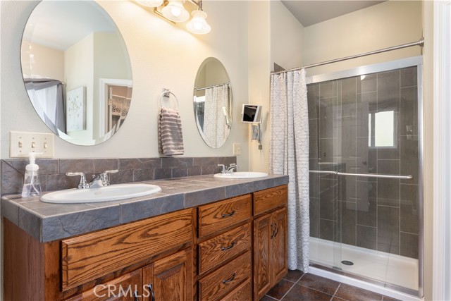 Master bath with walk-in shower and dual sinks