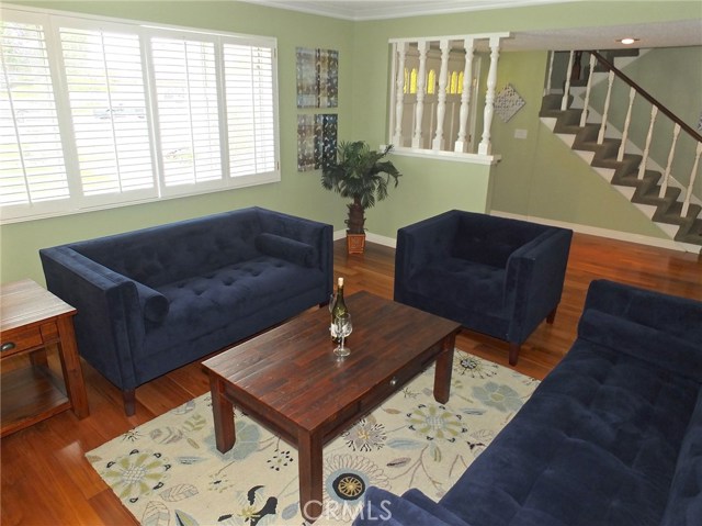 The living room boasts Crown molding wonderful base boards and plantation shudders The living room boasts Crown molding wonderful base boards and plantation shudders